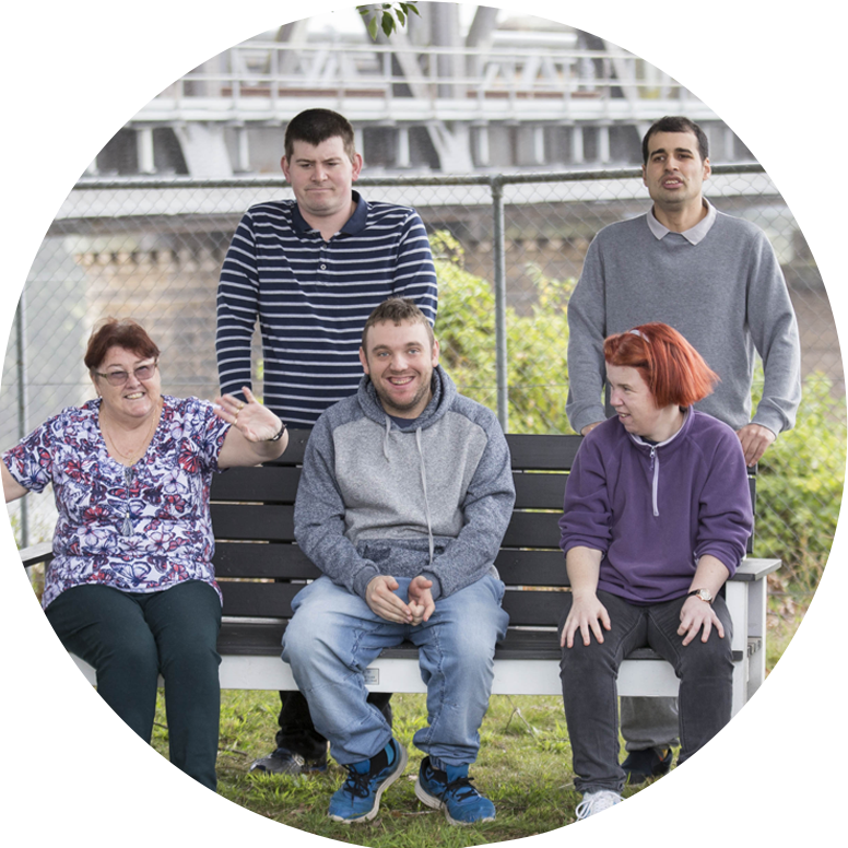 group of people sitting on bench