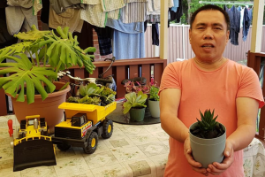 Man holding pot plant