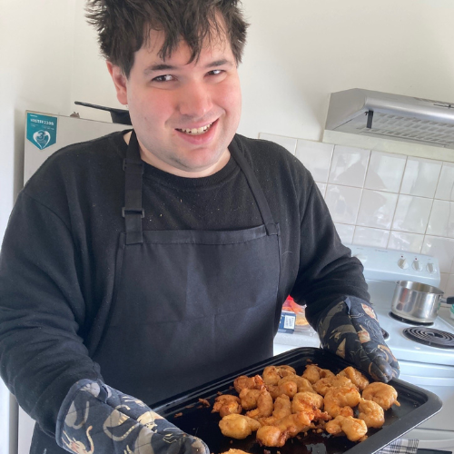Thomas holding his baking tray